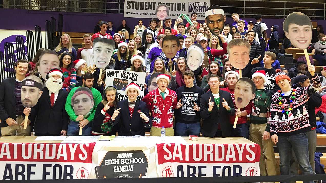 HITTING THE COURTS: Students, led by N-Zone, cheer in Christmas apparel to help support the boys' varsity basketball team to victory against DGS on Dec. 17.