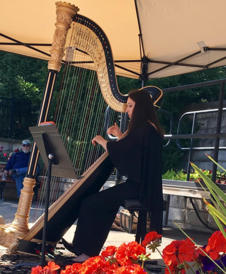 PLUCKING THE STRINGS: Catherine Ramsey (10) performs her musical skills in front of the community.