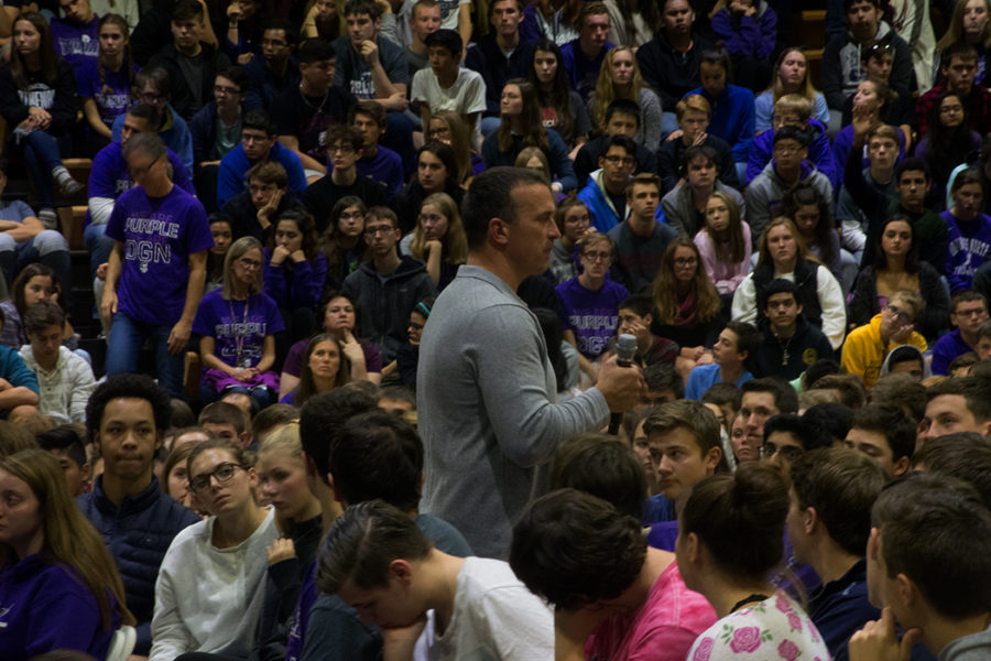 Staring in awe. a crowed stares in interest as Chris Harren talks to a crowed of DGN students