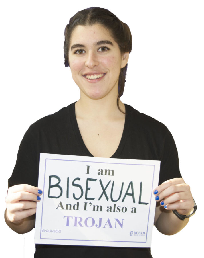 SHARING HER STORY: Selma El-Badawi (12) poses for a staged photograph holding a sign displaying her sexuality.