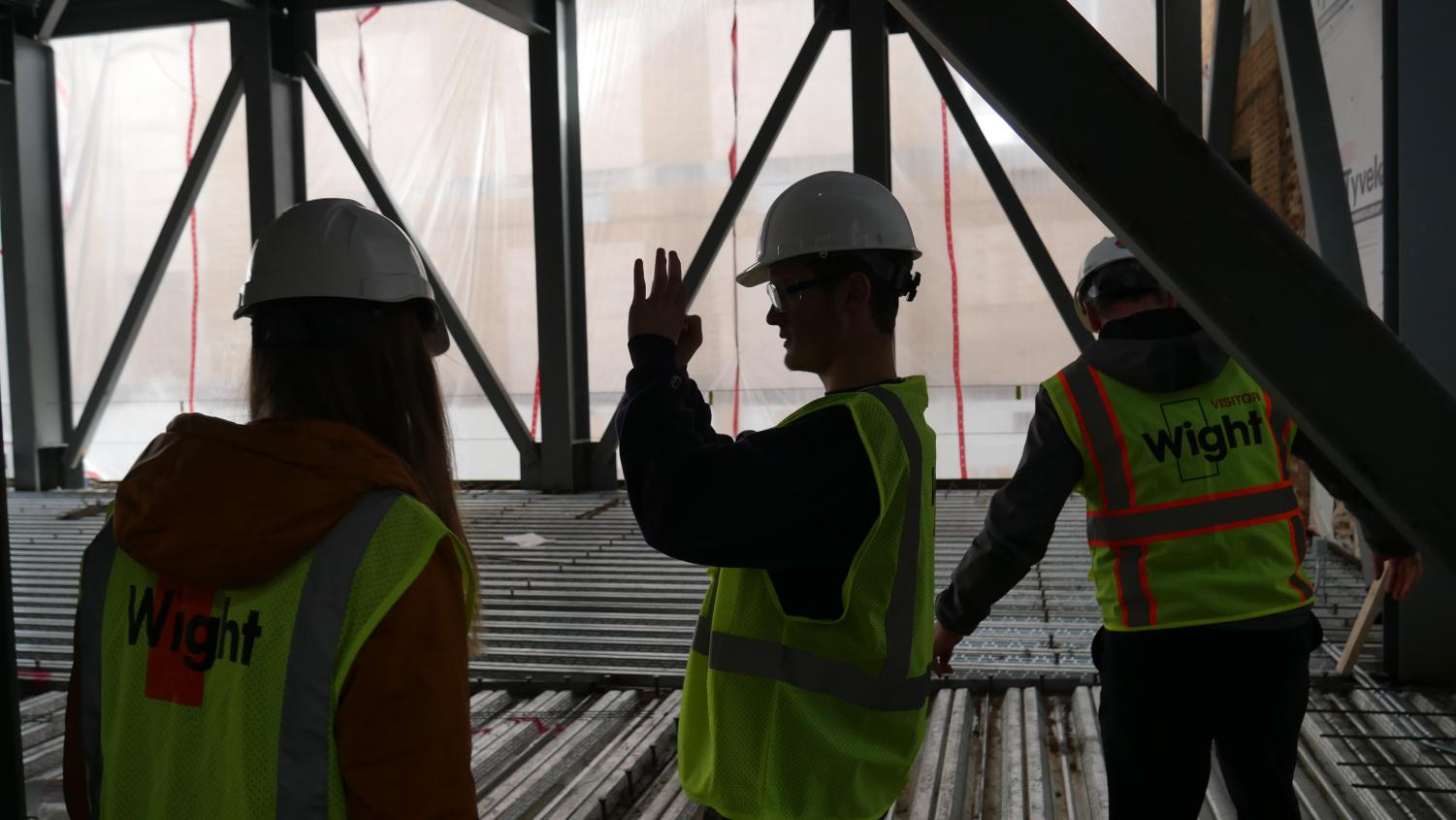 Omega Editor-in-Chief Sam Bull snaps a photo of the construction site.