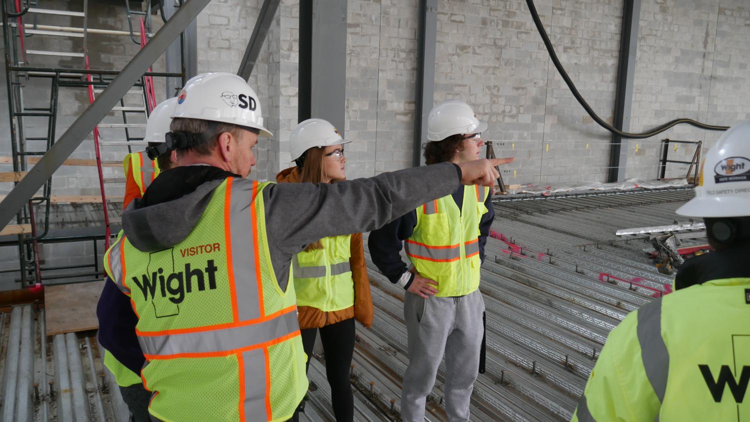Dr. Sorensen points out a detail of the new multipurpose room.