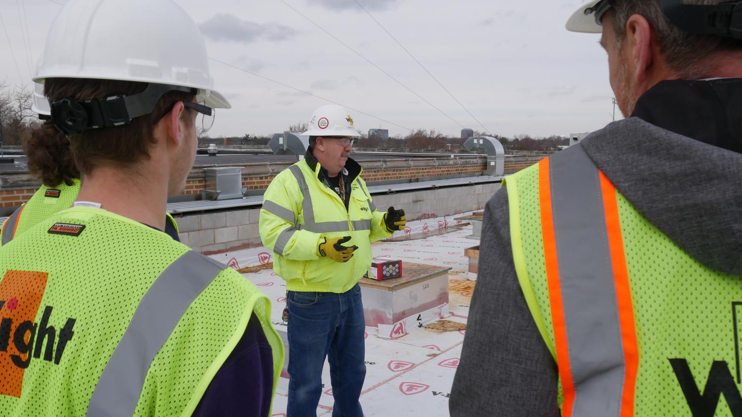 Wight Construction Field Safety Director, Michael Lynch, explains how his team deals with snow on the construction site. Lynch says a majority of the snow melts due to the heaters underneath the floor, but some areas still accumulate snow due to current lack of proper heating systems.