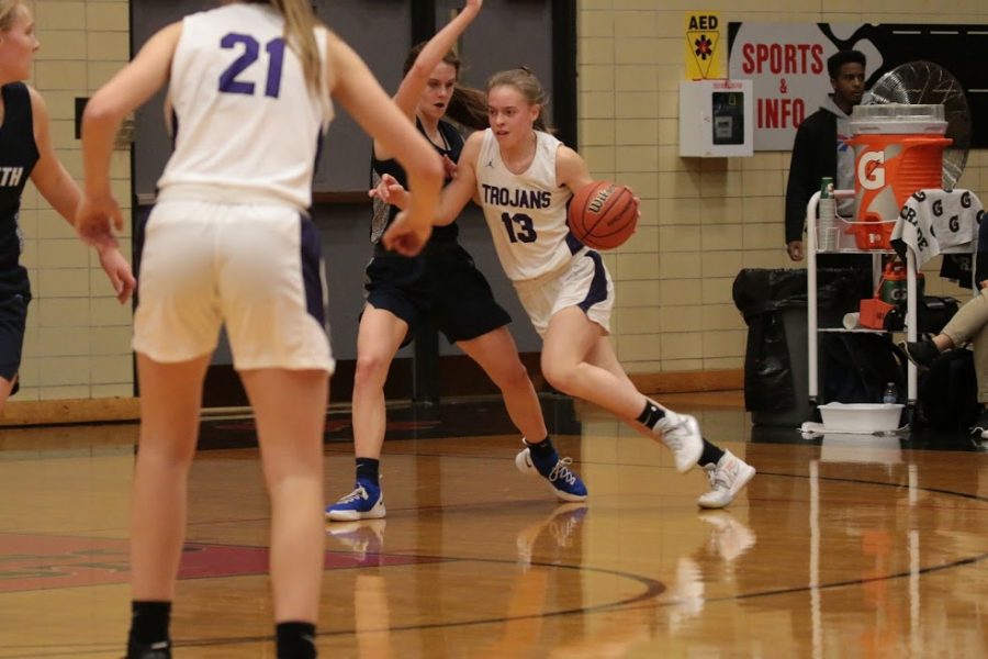 MAKING A MOVE: Maggie Fleming (09) drives against Nazareth. the Trojans beat the Roadrunners 45-31 to claim a Regional title.  