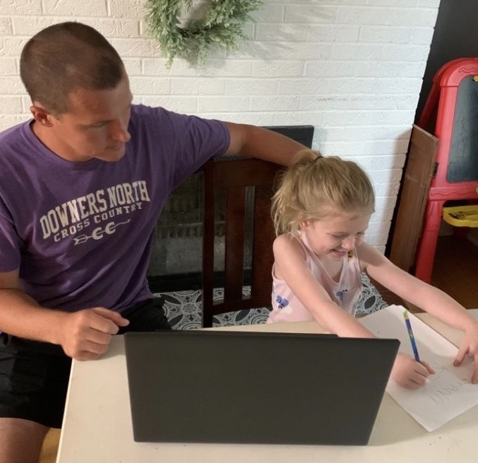 TEACHING FROM HOME: science teacher Bob Calder helps his daughter during remote learning.