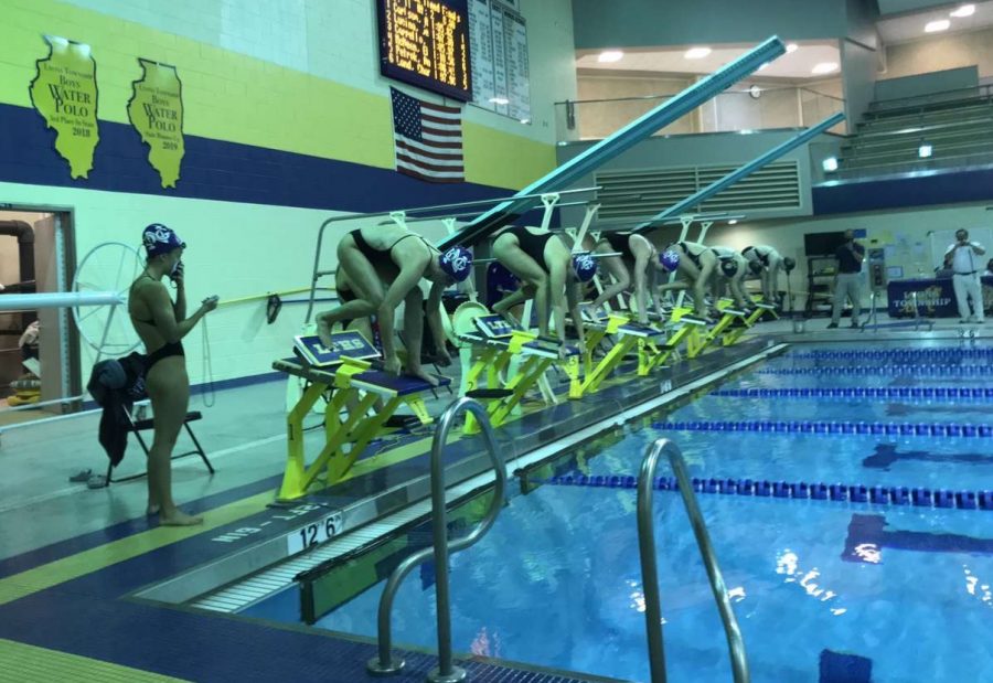 ON YOUR MARKS, GET SET, GO: DGN and LT swimmers prepare to race at a Sept. 10 meet.