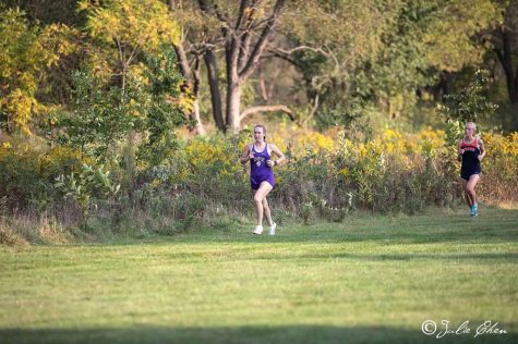 Sprinting towards success: Junior Elena Tomchek finishes in first place at a conference meet