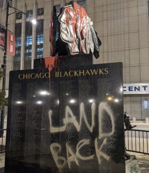This Chicago Blackhawks statue outside the United Center was defaced on Indigenous Peoples Day earlier this year (original image from Twitter user @zhigaagoong)