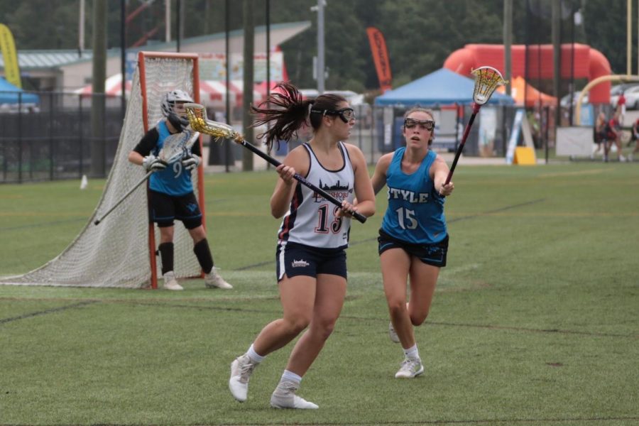 ON THE ATTACK: Senior Madeline Schallmoser settles the ball before making a move on the cage at a tournament with her club team, Lakeshore Lacrosse.