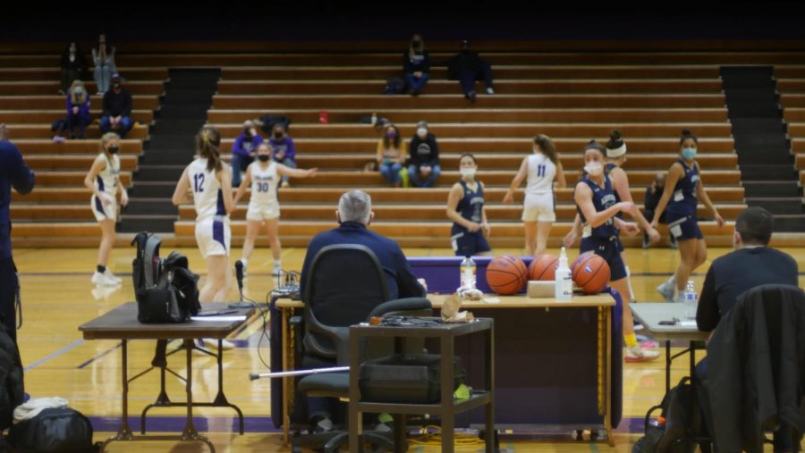BEHIND THE SCENES: The capacity of the Purple Gym was restricted. Sideline benches were distanced, and each home athlete was allowed to bring 2 spectators. 