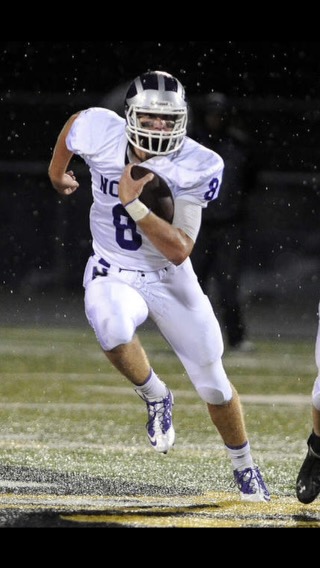 THROWBACK: Edwards runs down the field as the quarterback of the DGN Varsity football team.