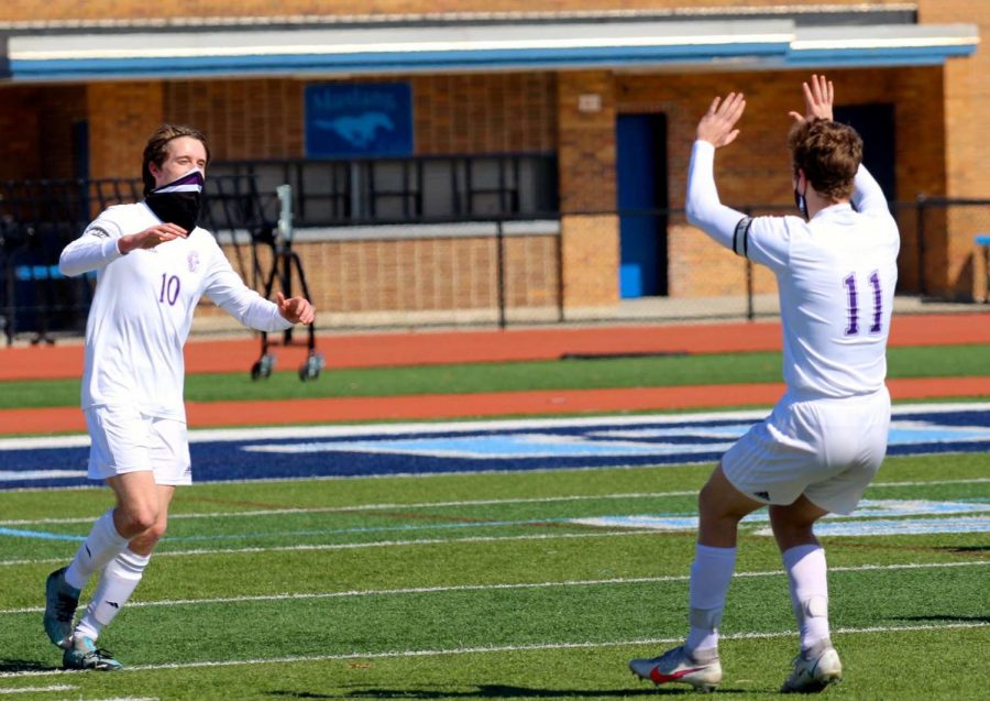 TEAM CAPTAINS: Trygve Hansen (left) and Sam Bull (right) celebrate after Hansen's goal in their victory against DGS. 