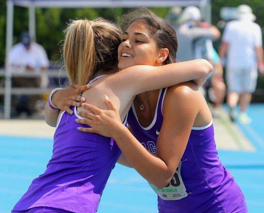 CELEBRATING: Incoming senior Abby Streff hugs graduated senior Kenna Cinotte after the 4x100 meter relay at state. 