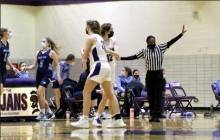 SUPPORT : Ryan Wendt (left) and Violet Mitchell (right) encourage each other during a game. 