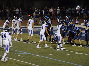      PINNED: The Trojan defense lines up against DGS near their endzone.
