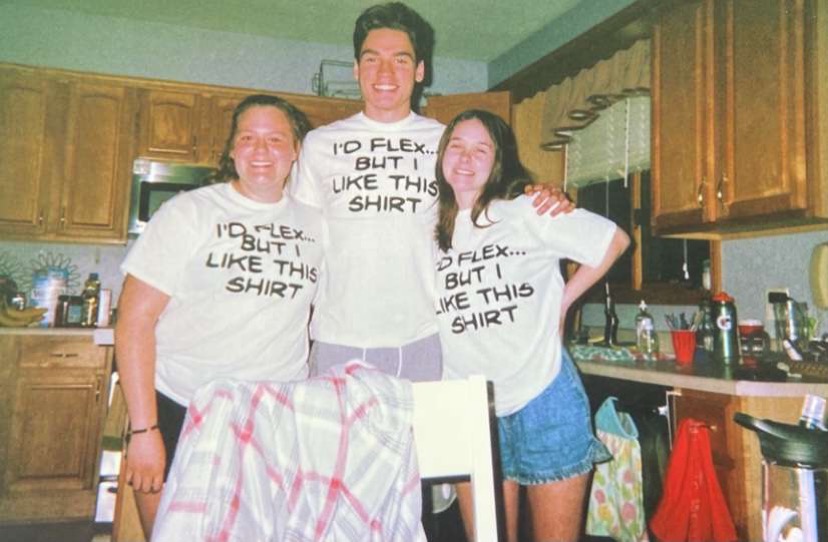 MATCHING: Allie Bojkovski (12), Mason, and Kate Laffey (12) take a disposable photo all wearing the same shirt.