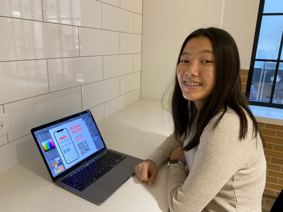 DESIGNING: Sophomore Gina Liu creates a new advertisement for her Road Buddy app. She uses her design skills to promote her app on social media.
