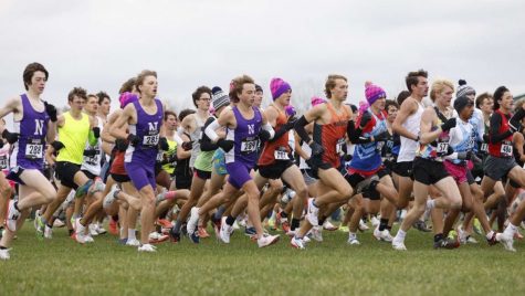 RUN WITH THE PACK: (from left to right) DGN runners Ryan Eddington (10), Jack Benge (12) and Topher Ferris (11) take off from the starting line at the Nike Cross Country Regional race Nov. 14.