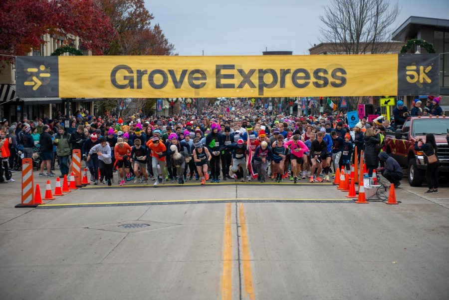 Participants run out at the start of the 2021 Grove Express