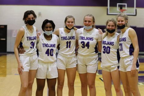 SENIOR SEASON: The six seniors line up after their senior night win. Gross (#11) lead the team with 22 points, the same amount that the entire GBW team scored against the Trojan defense.