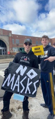 MASK CHOICE: DGN seniors Reed Hois (left) and Brooks Johnson (right) protest outside the school on Feb. 11, advocating for removal of the mask mandate.