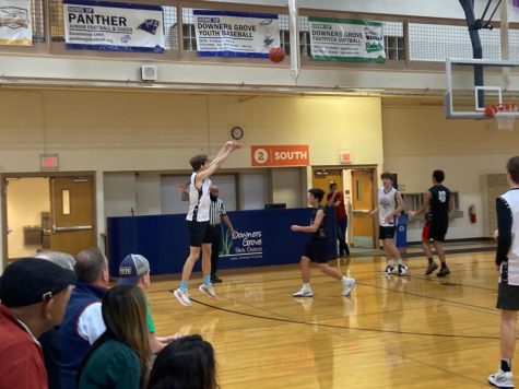 Champs: Ian Schuller (12) puts up a shot for The Comebacks against team Eric Baugh Select.