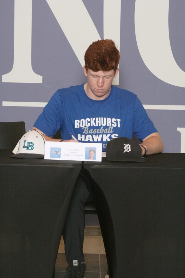 SIGNING: Jack Miller (12) signs his contract with Rockhurst University to play NCAA Division II baseball. 
