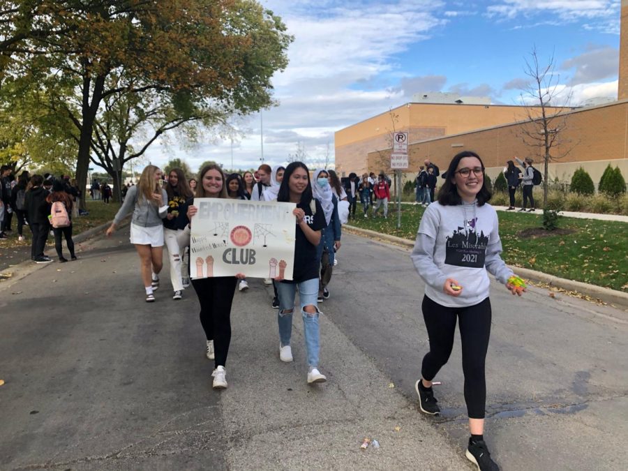 LEADING THE GROUP: Gwen walks with the Empowerment club in the 2021 homecoming parade. 