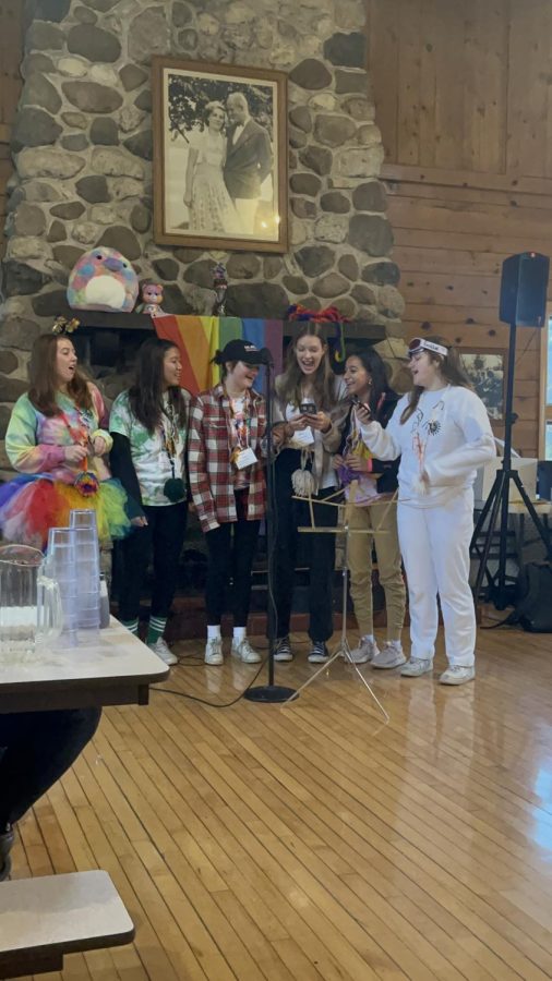 MORNING TRADITIONS: senior Abbey Goddard and juniors Gina Liu, Fiona Doyle, Jenna Soelberg,  Malini Fisher, and Maggie Cummins sing together for participants before breakfast. 