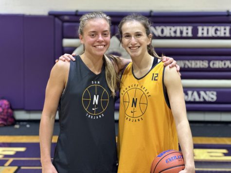 SLAM DUNK: Club presidents and seniors Maggie Fleming and Violet Mitchell pose after basketball practice. 