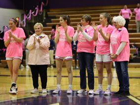 BLEED PINK: honorary captains recognized at half court. 