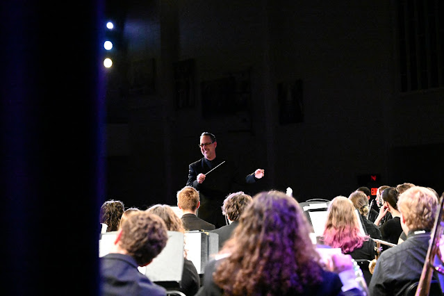 PASSING THE BATON: Teague conducts the band for the 2023 graduation concert. 