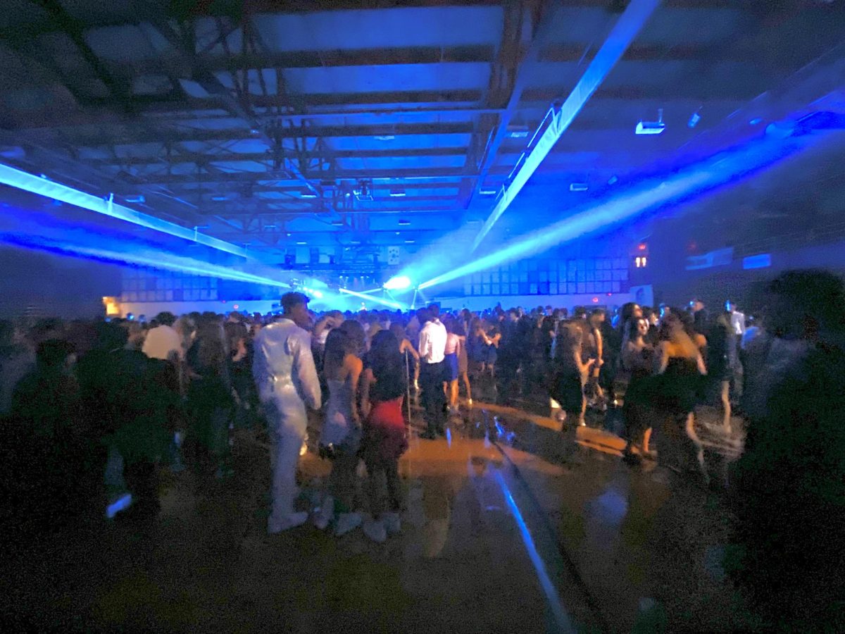 LOCO FOR HOCO: Students party in the purple gym during the 2023 homecoming dance.