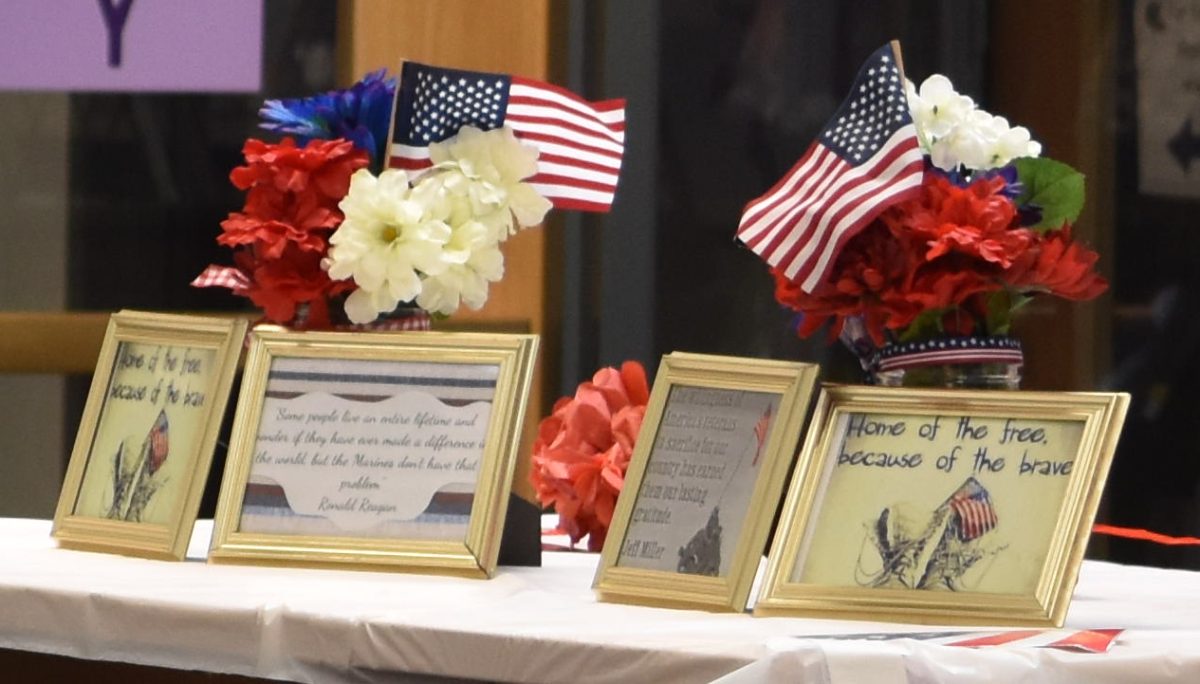 PATRIOTIC PRAISE: Decorations throughout the library commend veterans and all those serving in the armed forces, ranging from American flags to a framed picture of the phrase “Home of the free, because of the brave.”