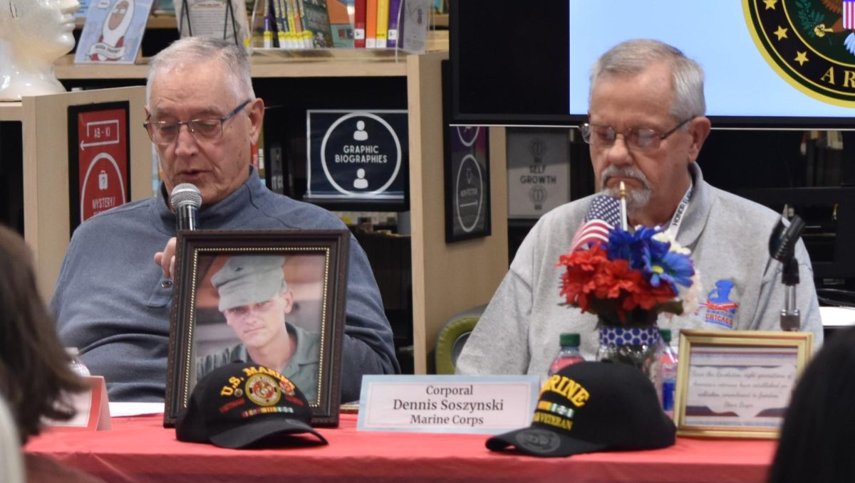 FROM VETERAN TO VOLUNTEER: Vietnam veteran and former Marine Corps Corporal Dennis Soszynksi (right) displays various mementos from his time in the military. Soszynksi now resides in Downers Grove and enjoys helping the community by delivering books to housebound residents and clearing invasive species from forest preserves.