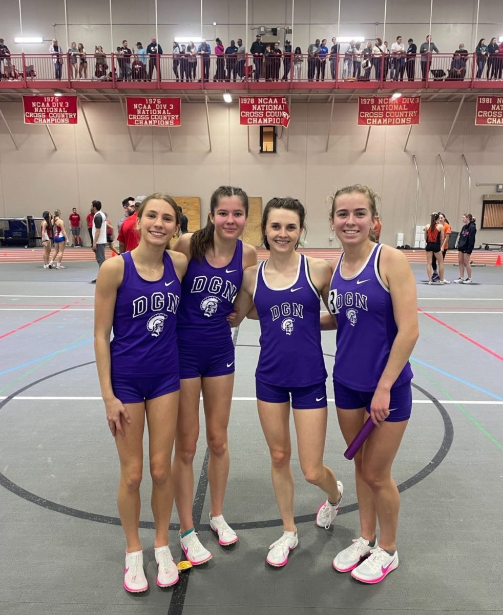 Ava Gilley (11), Lily Eddington (10), Sarah Paul (12), and Sydney Hnatiuk (12) after breaking the 4 x 800 meter record.