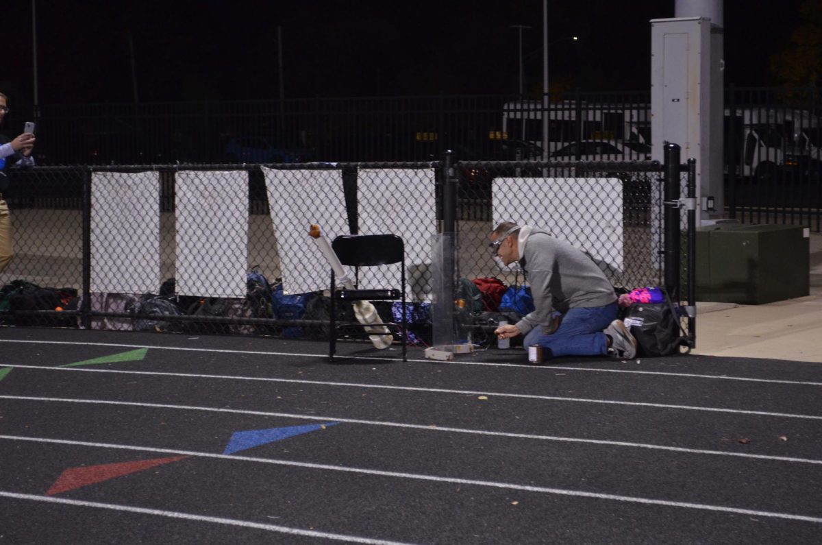 WITH A BANG: Science teacher John Sipple fires "mole cannon."