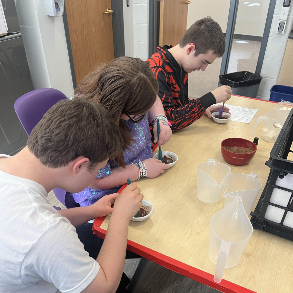 WORKING HARD: Students in the READY program mix scented soaps for the holiday season