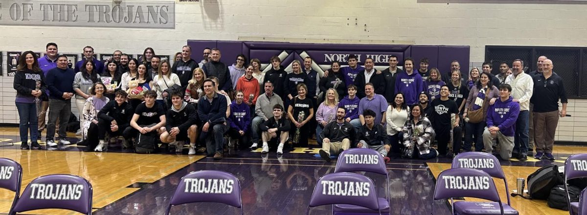 BETTER TOGETHER: Senior boys pose with their families and coaches.