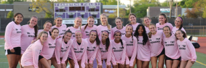 SENIOR SMILES: the 23-24 girls' varsity team smiles together to send off their seniors' last season.