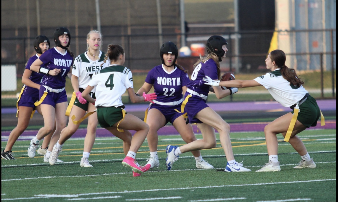 Breaking Through: Ivy Knopf (12) jukes through defenders during a game.
Photo courtesy of Lightroom