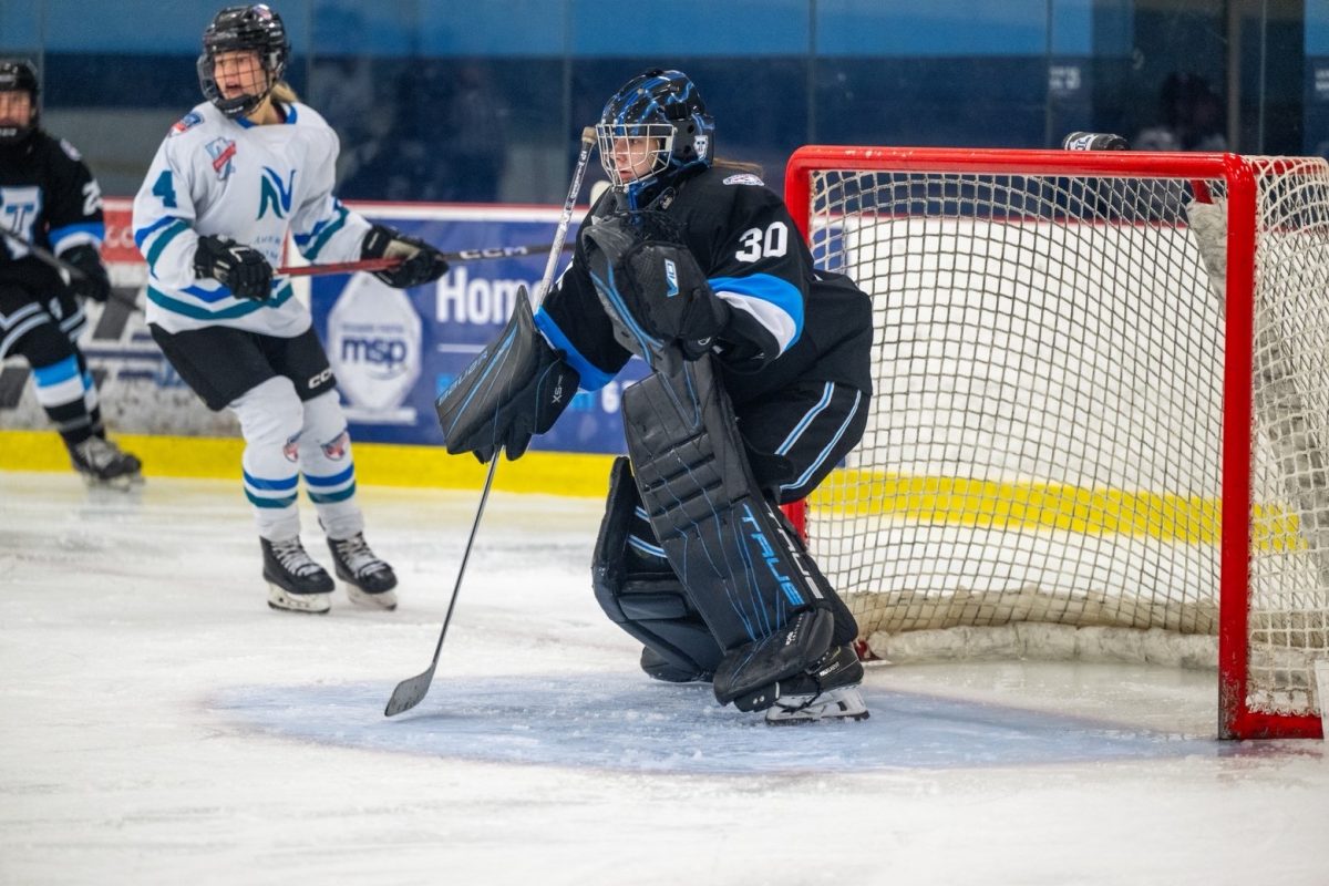 On the ice: Weilenberg defends the goalpost of the Downers Grove team.